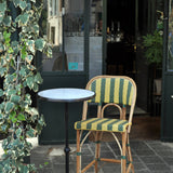 Our bar height bistro table and chair in a restaurant in France.