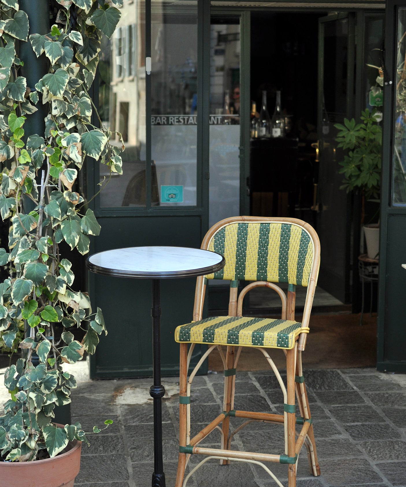 Our bar height bistro table and chair in a restaurant in France.